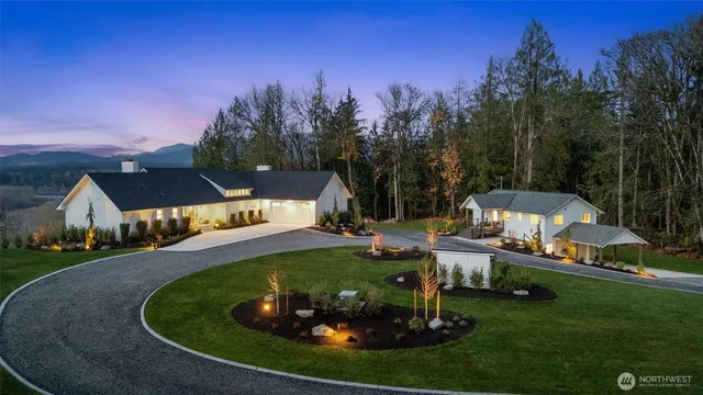 a view of a garden with lawn chairs and a fire pit