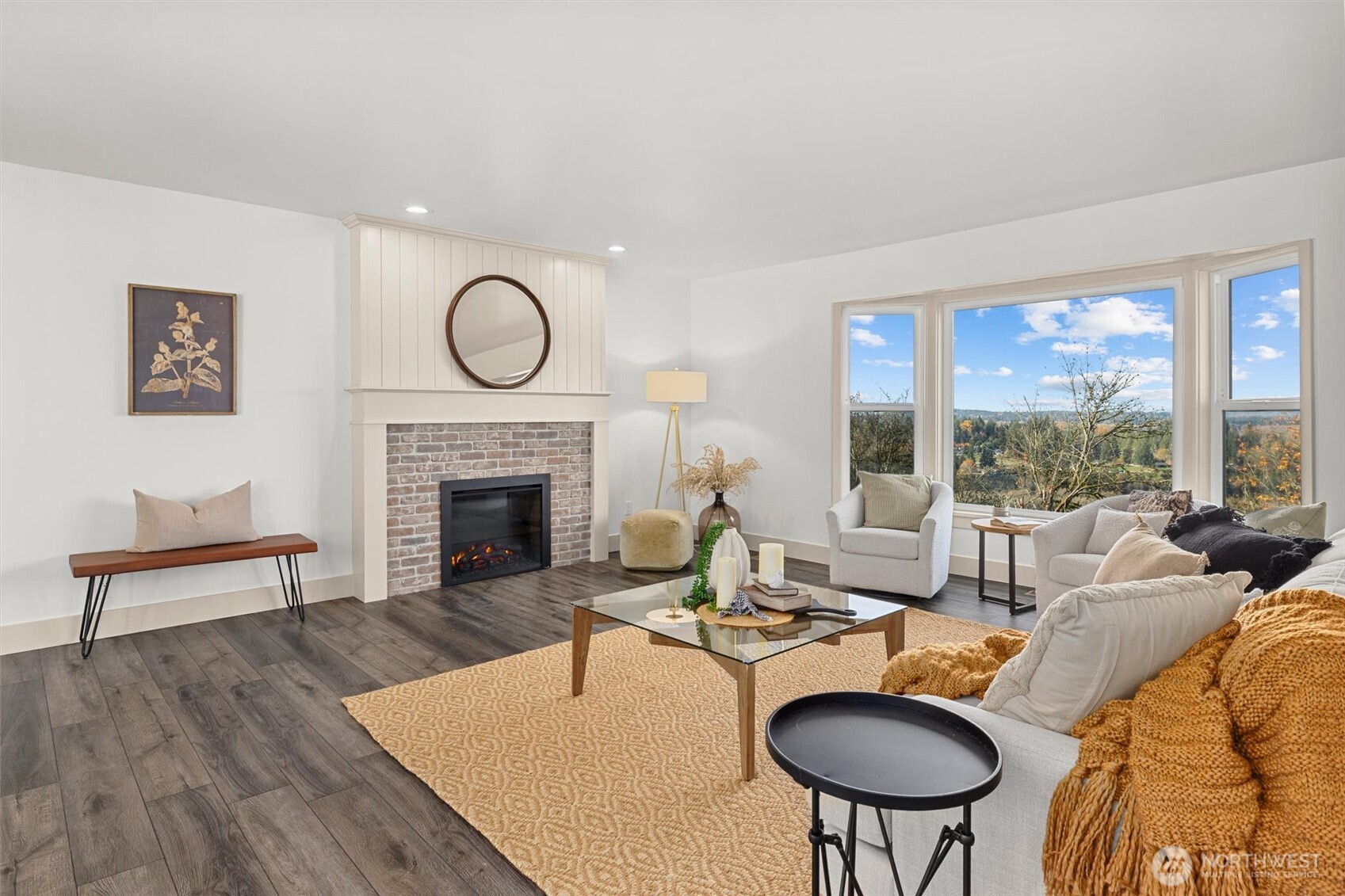 9813 Moran Road Arlington, WA 98223 - Photo 11 of 40 a living room with furniture a table and a fireplace