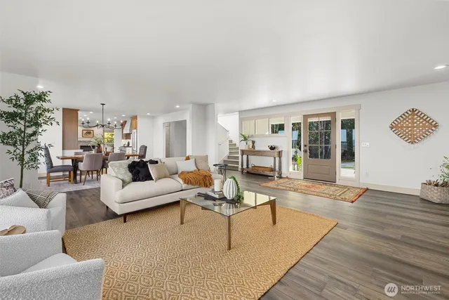 a living room with furniture or couch and a wooden floor