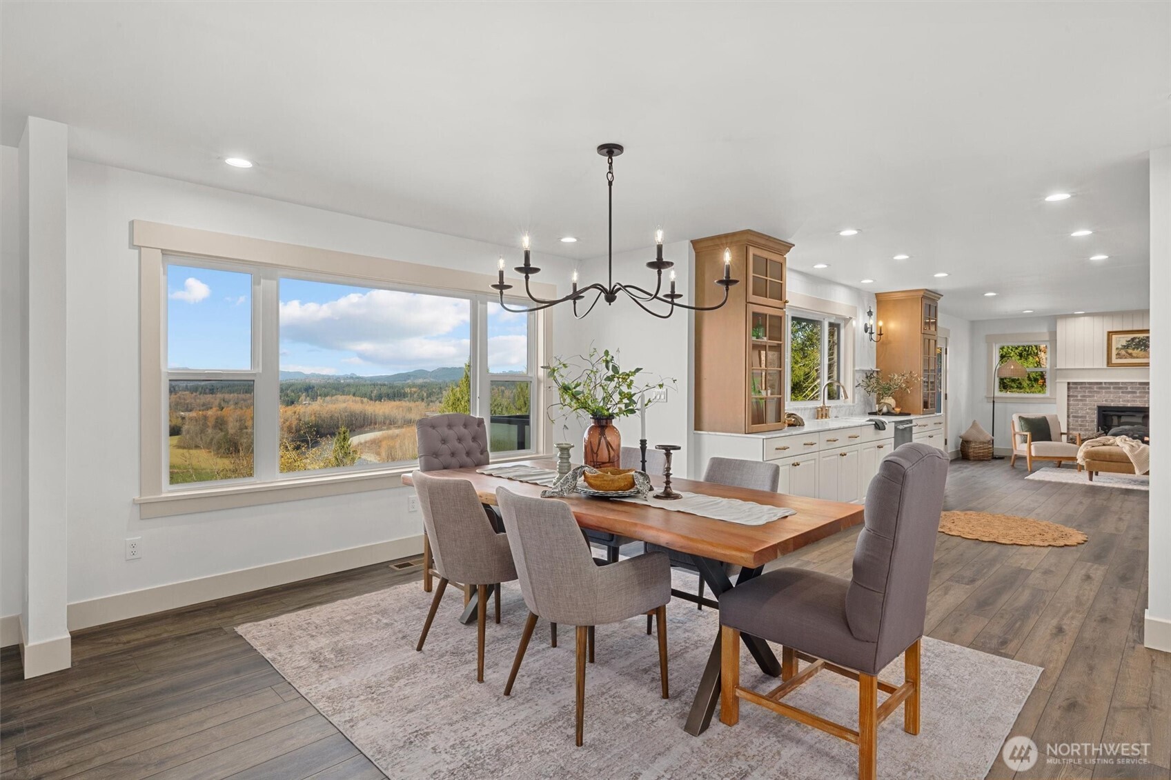 9813 Moran Road Arlington, WA 98223 - Photo 14 of 40 a view of a dining room with furniture window and wooden floor