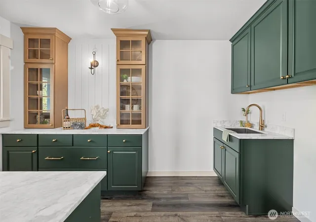 a kitchen with a sink and cabinets