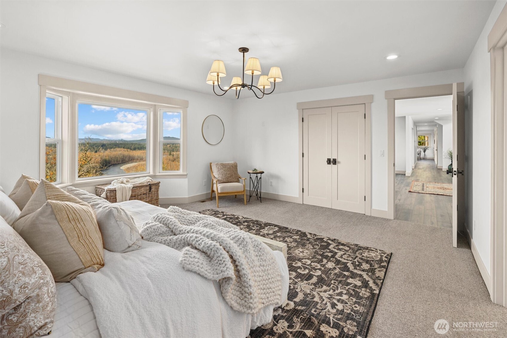 9813 Moran Road Arlington, WA 98223 - Photo 22 of 40 a bed room with a bed mirror and a large window