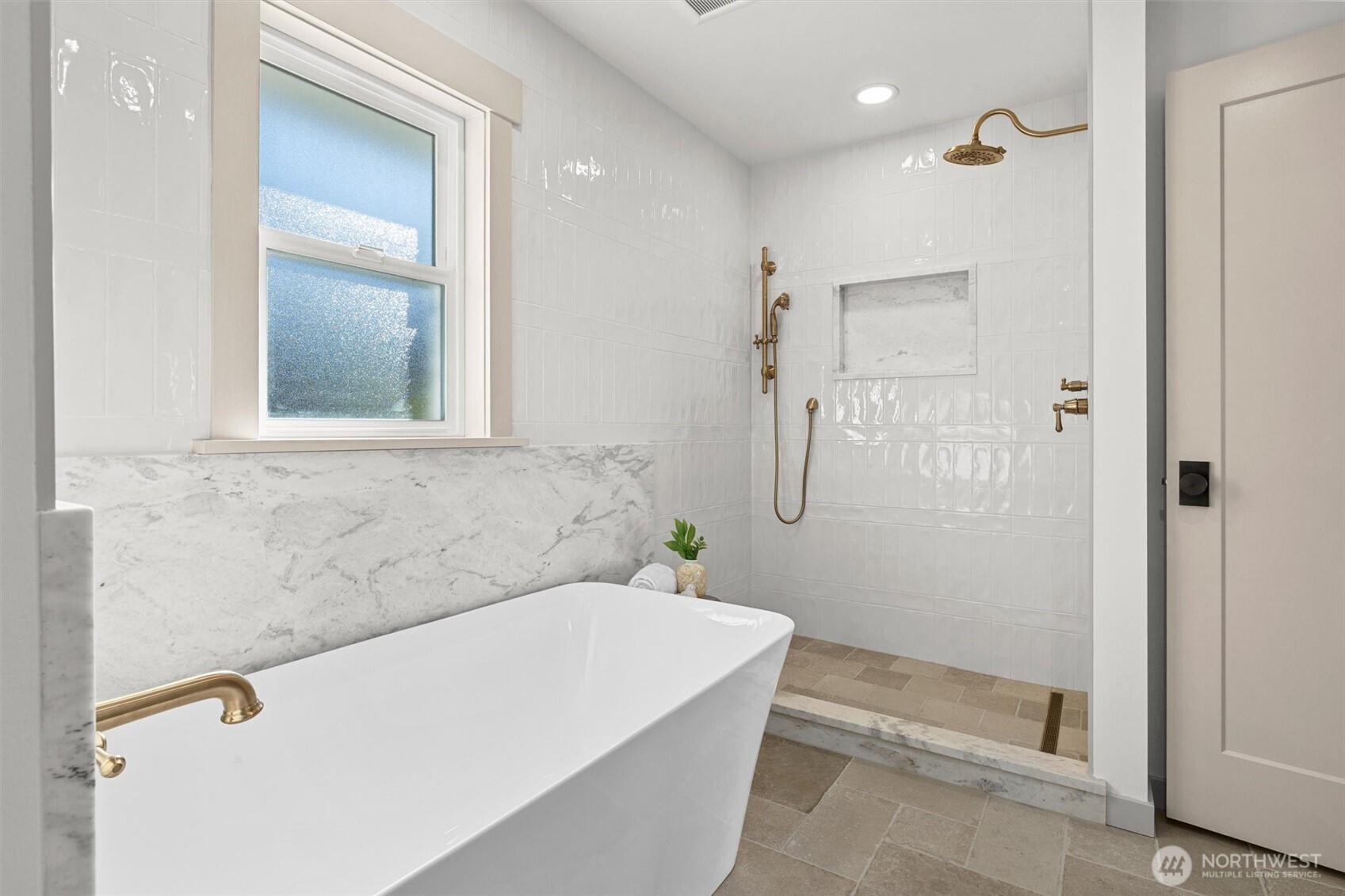 9813 Moran Road Arlington, WA 98223 - Photo 24 of 40 a bathroom with a bathtub and a shower