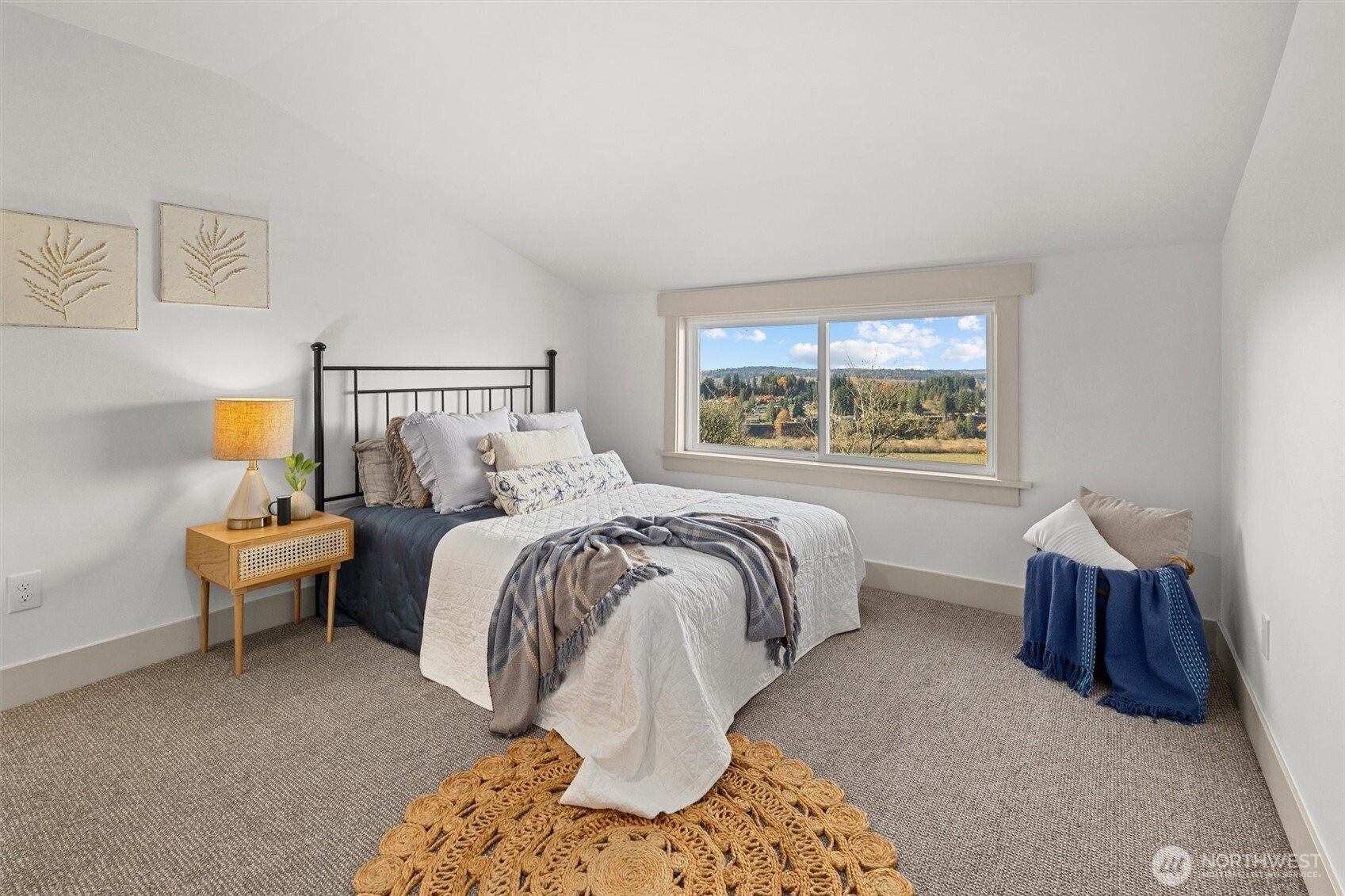 9813 Moran Road Arlington, WA 98223 - Photo 32 of 40 a spacious bedroom with a bed and window