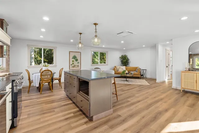 a kitchen with stainless steel appliances granite countertop lots of counter top space