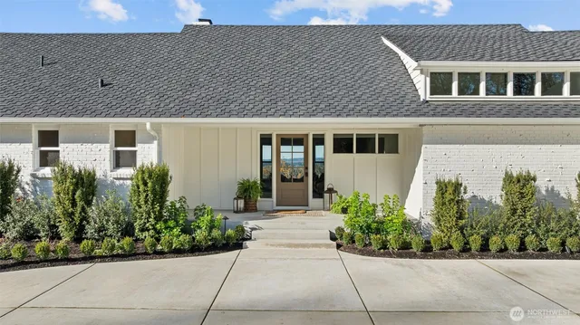 a front view of a house with garden