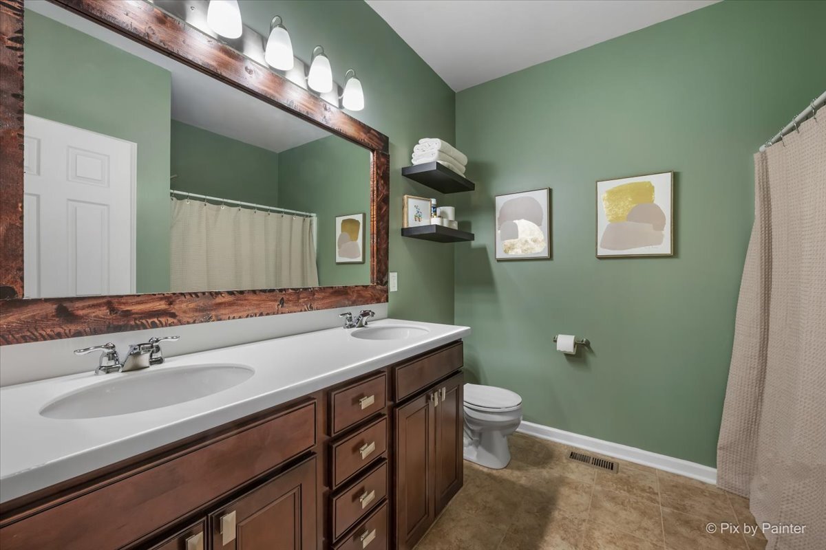 691 Windett Ridge Road Yorkville, IL 60560 - Photo 25 of 42 a bathroom with a sink and a mirror