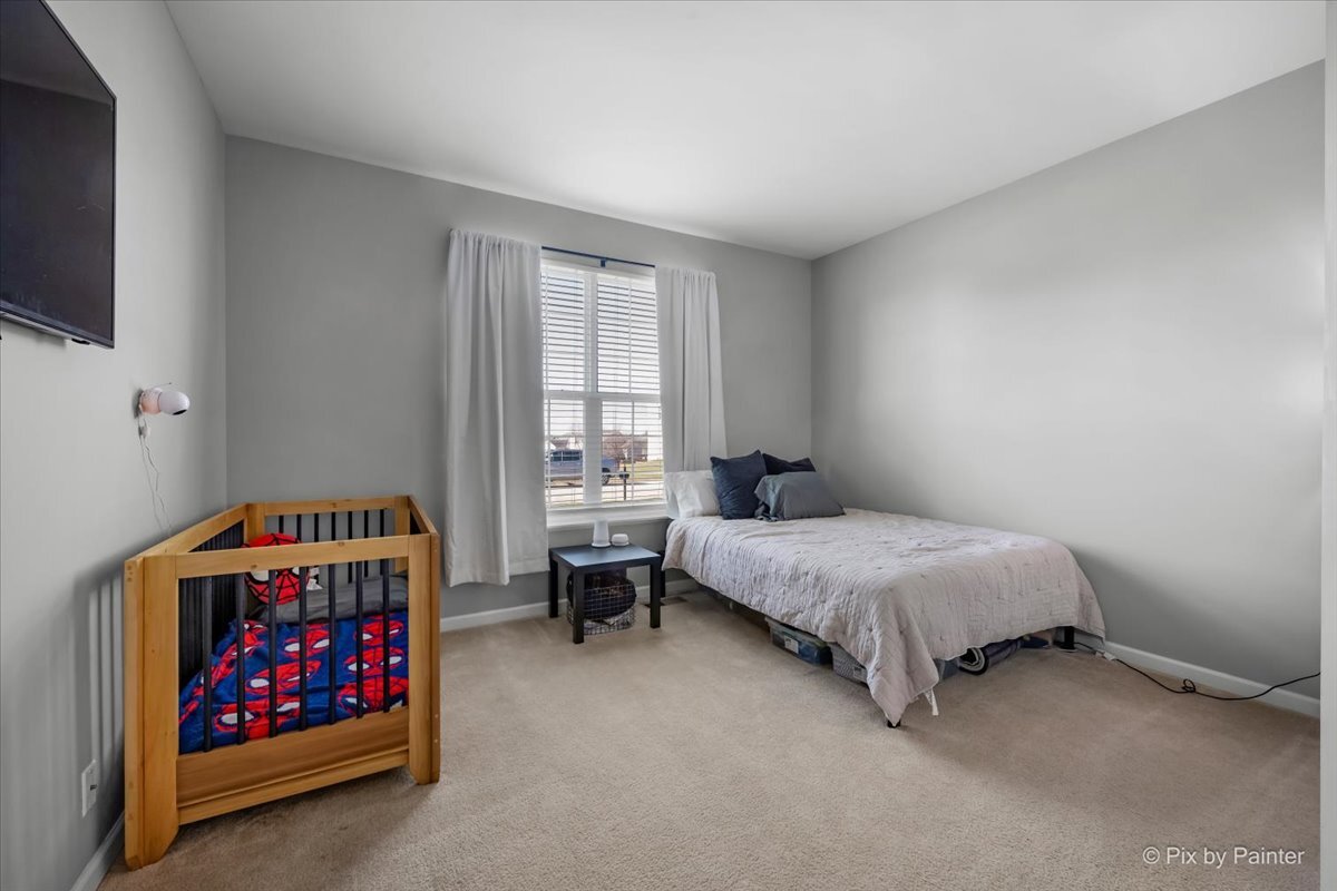 691 Windett Ridge Road Yorkville, IL 60560 - Photo 26 of 42 a bedroom with a bed and a window
