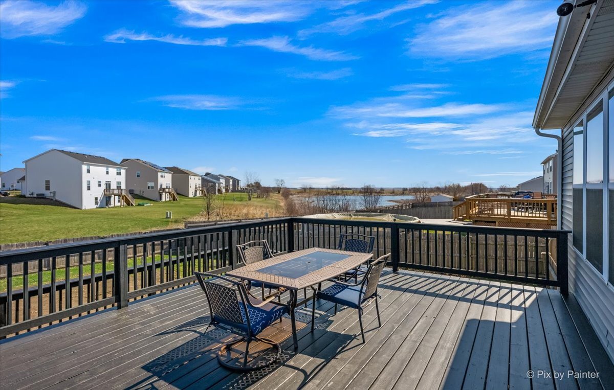 691 Windett Ridge Road Yorkville, IL 60560 - Photo 37 of 42 a view of a balcony with wooden floor and outdoor seating