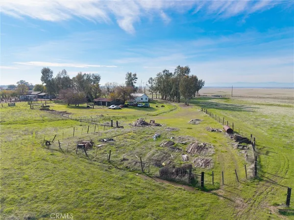 a view of a field with an ocean