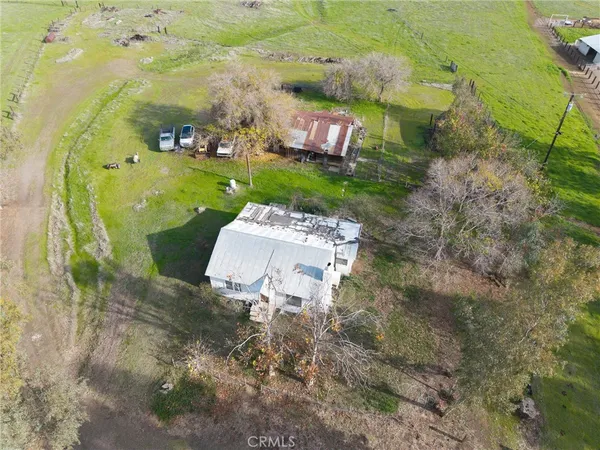 an aerial view of a house with outdoor space