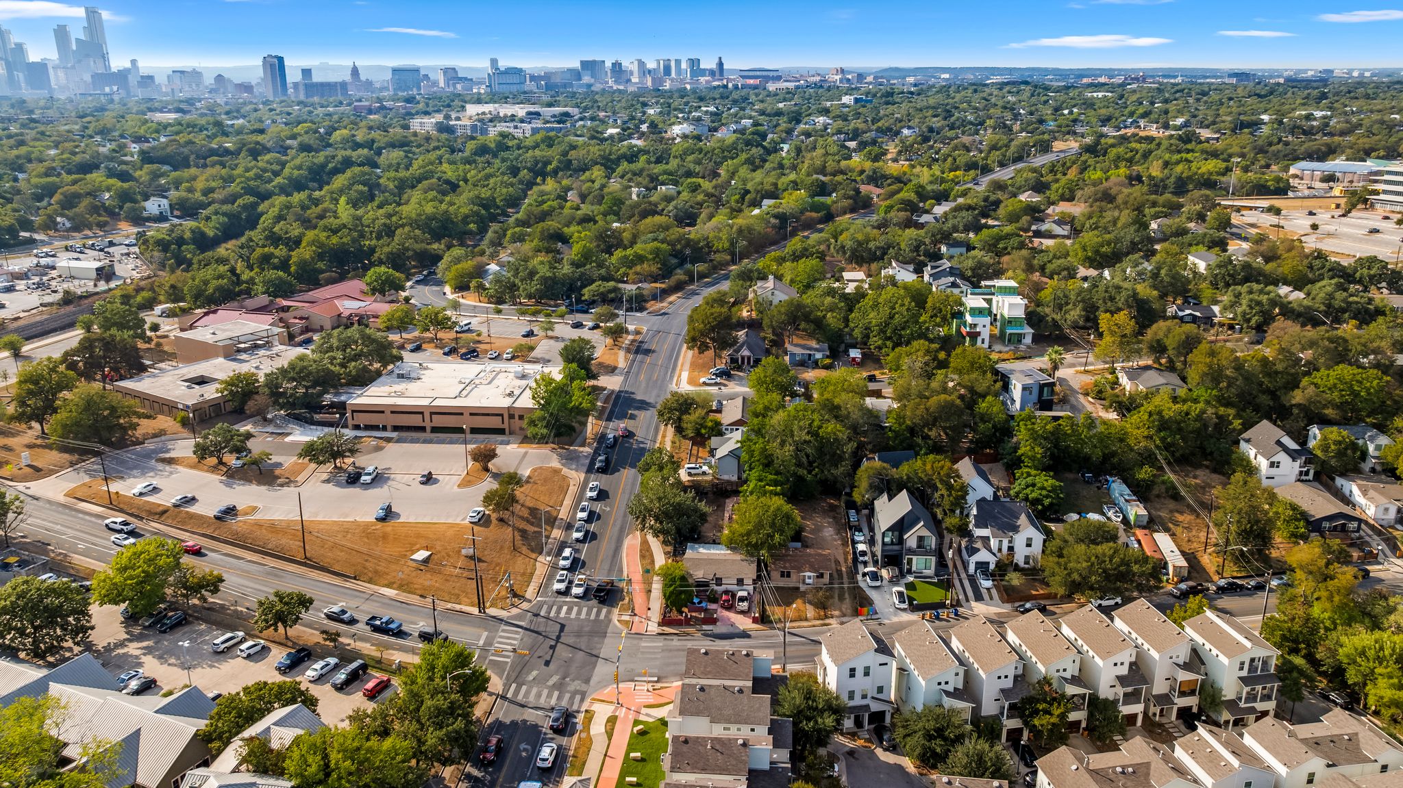 2900 Webberville Road Austin, TX 78702 - Photo 8 of 22 An aerial perspective captures the neighborhood landscape stretching toward the distant city skyline.