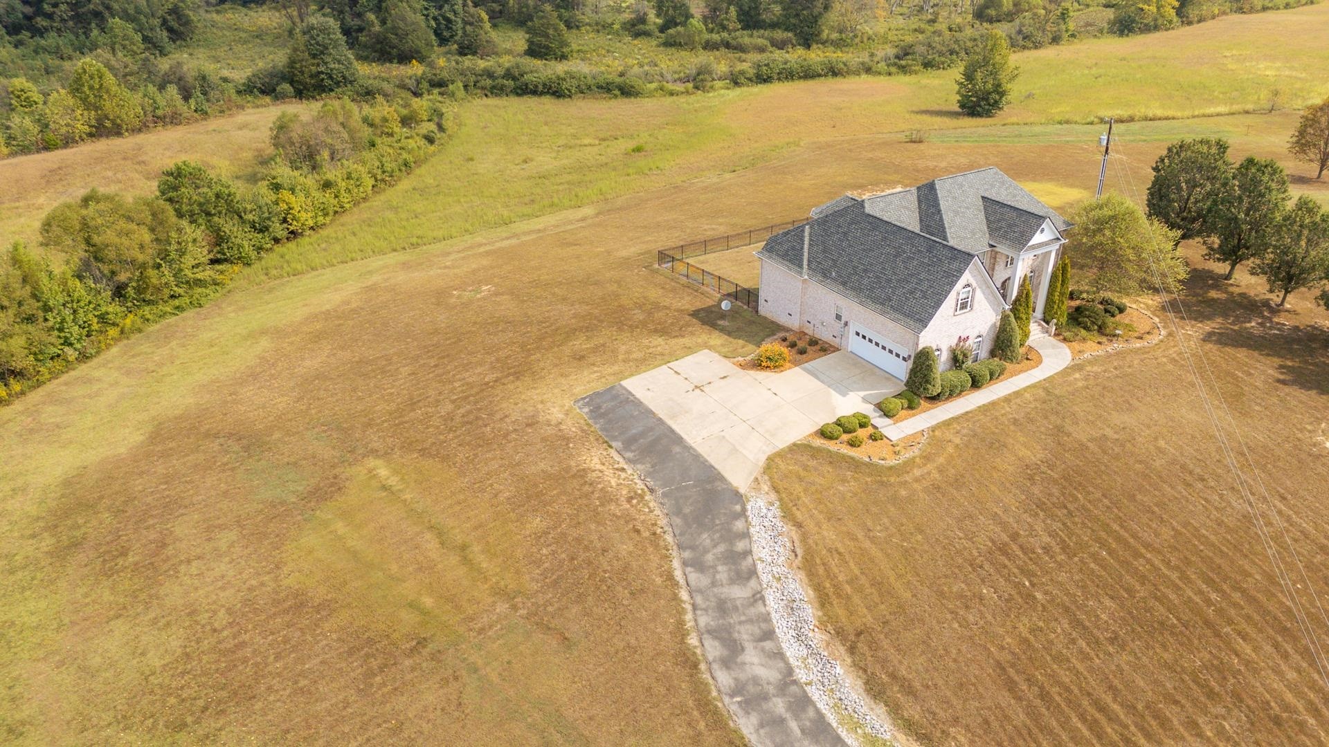 5166 Middlefork Road Luray, TN 38352 - Photo 39 of 40 a view of a swimming pool with a lawn chairs