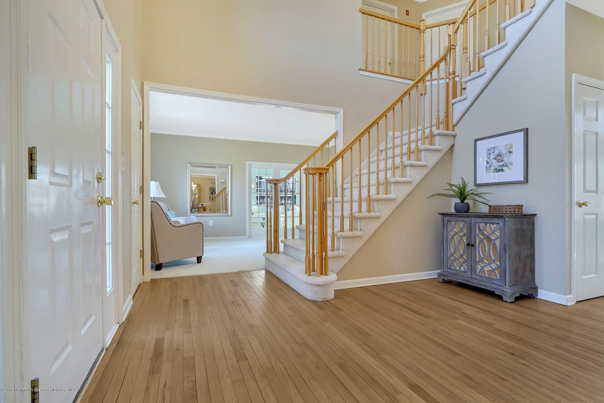 263 Pin Oak Road Freehold, NJ 07728 - Photo 12 of 60 a view of entryway with wooden floor