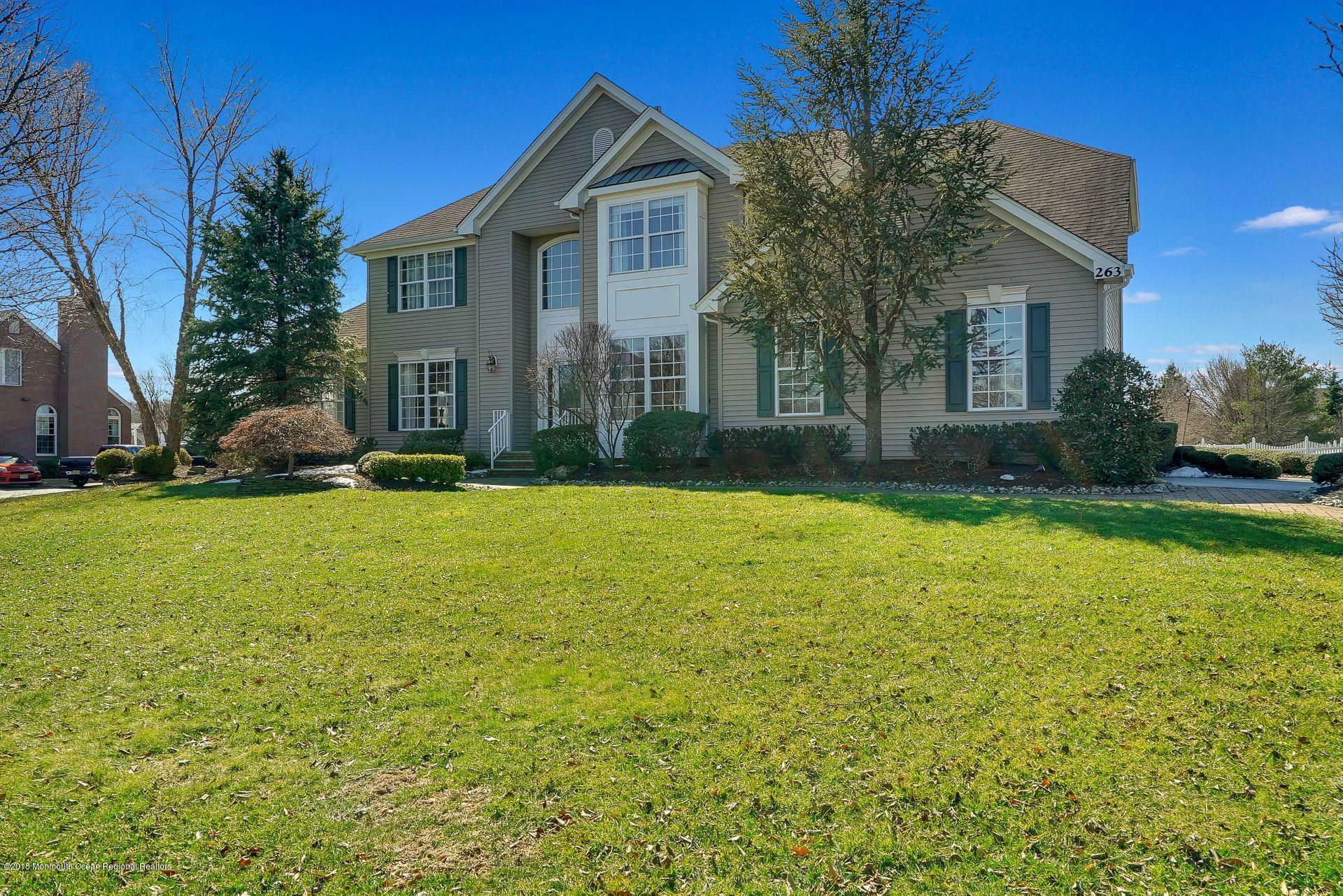 263 Pin Oak Road Freehold, NJ 07728 - Photo 2 of 60 a front view of house with yard and green space