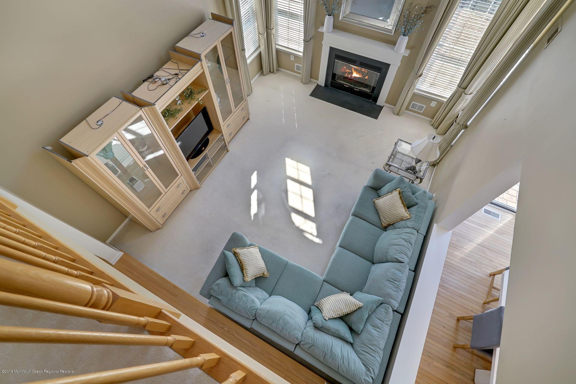 263 Pin Oak Road Freehold, NJ 07728 - Photo 31 of 60 a living room with furniture and a fireplace