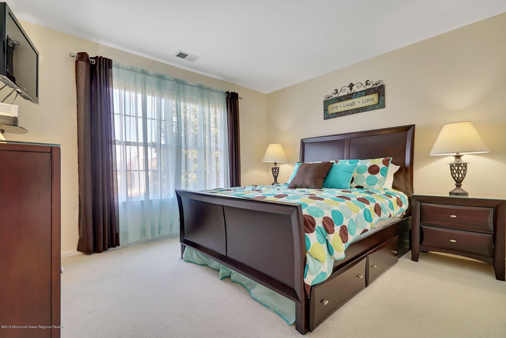 263 Pin Oak Road Freehold, NJ 07728 - Photo 38 of 60 a bedroom with a bed and a window