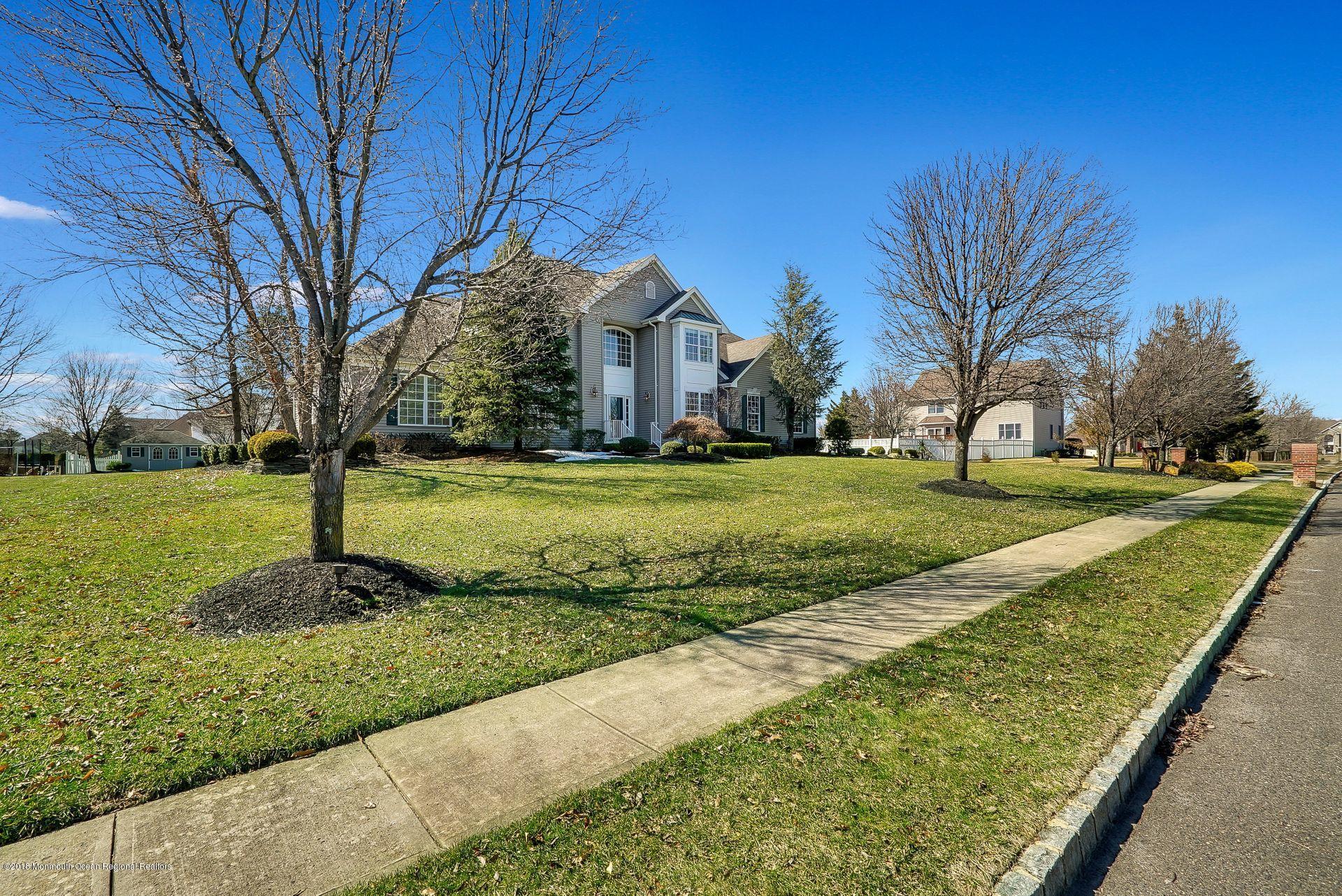 263 Pin Oak Road Freehold, NJ 07728 - Photo 4 of 60 a front view of a house with a yard