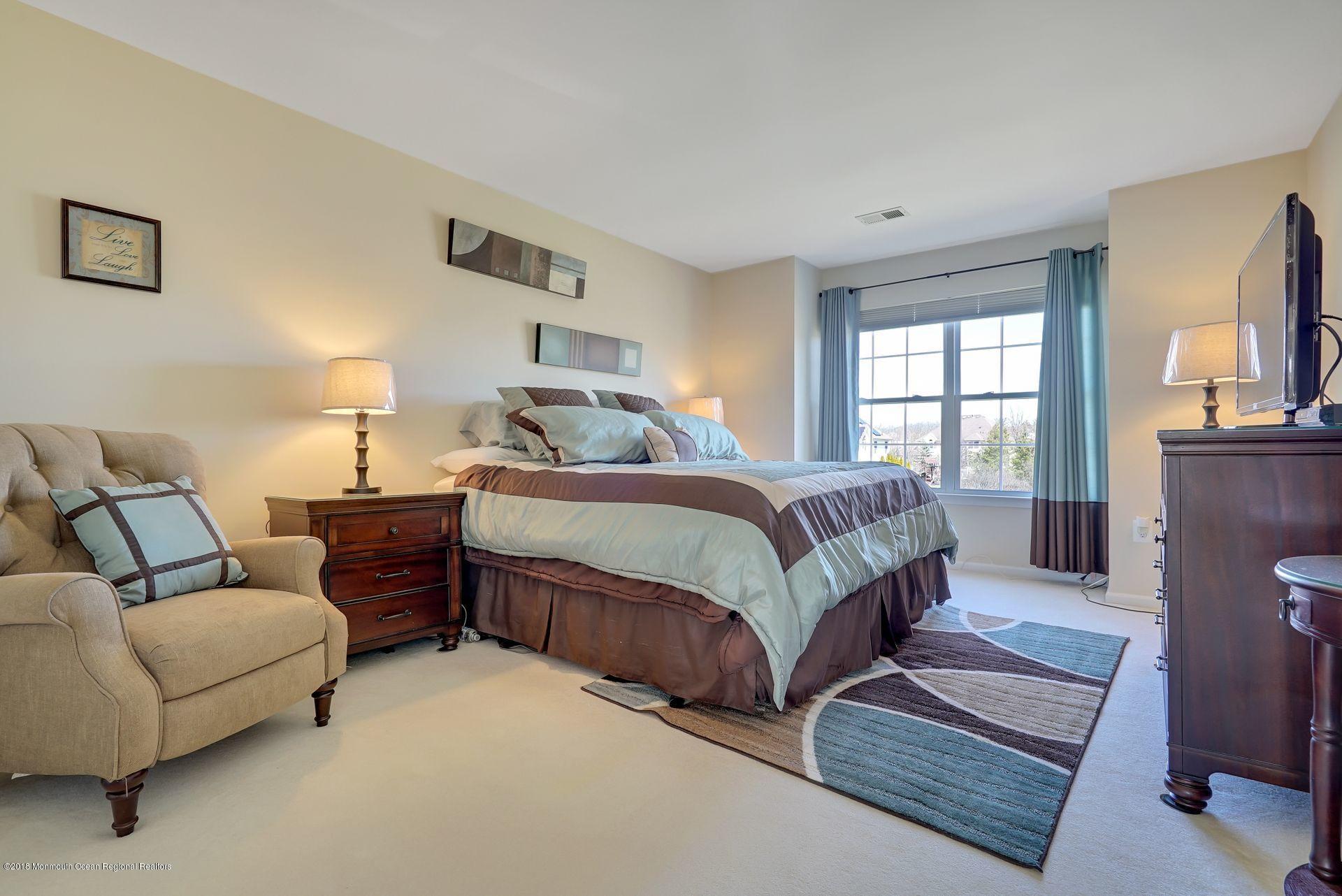263 Pin Oak Road Freehold, NJ 07728 - Photo 41 of 60 a bedroom with a bed couch tv and window