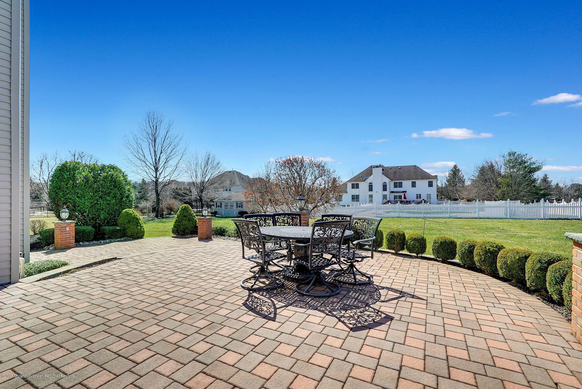 263 Pin Oak Road Freehold, NJ 07728 - Photo 47 of 60 a view of swimming pool with outdoor seating and plants