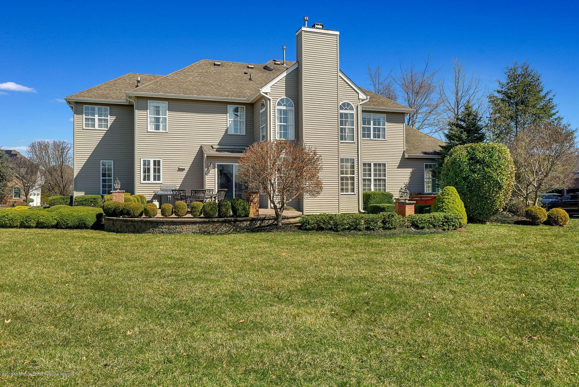 263 Pin Oak Road Freehold, NJ 07728 - Photo 51 of 60 a front view of a house with a yard