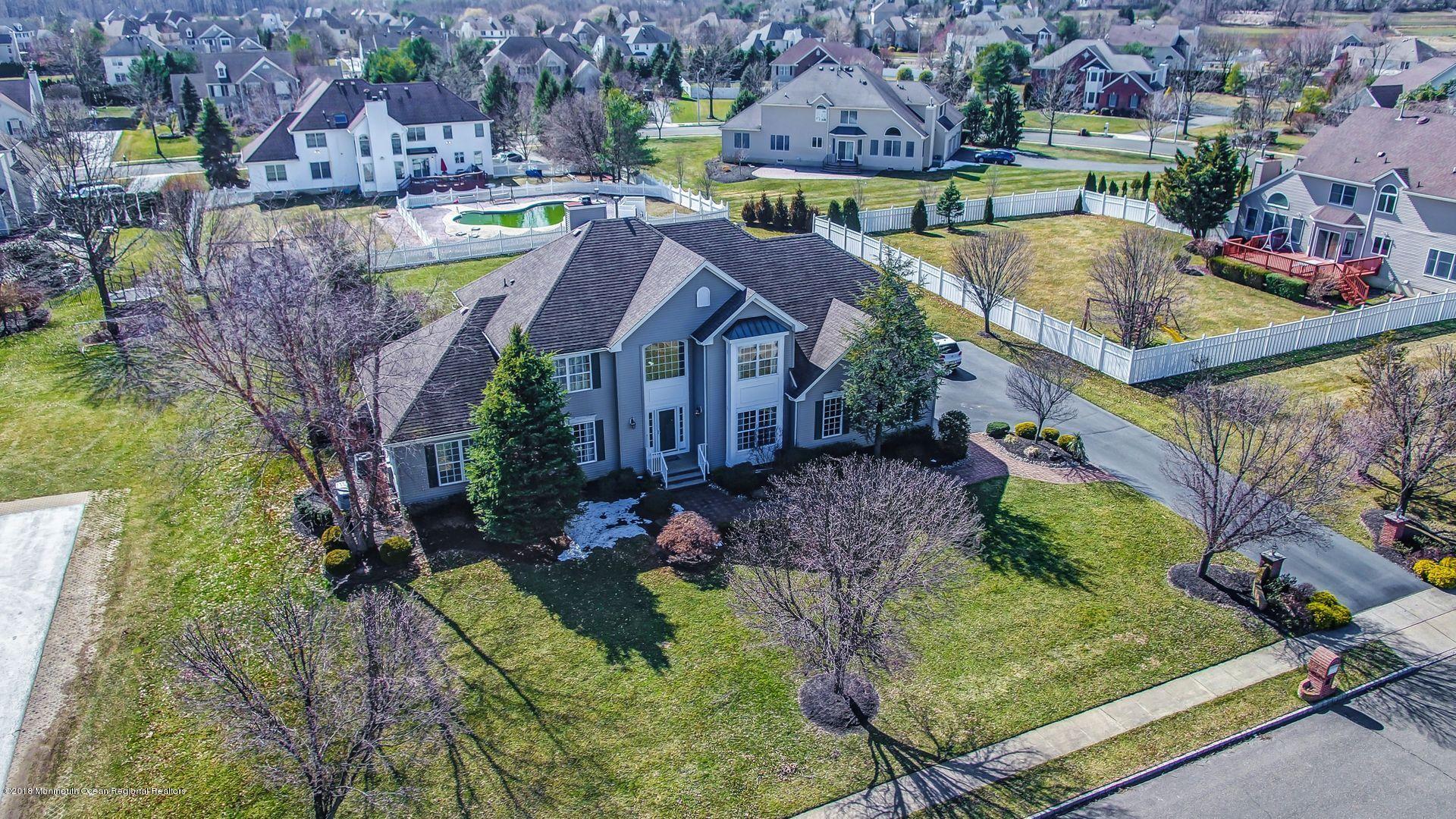 263 Pin Oak Road Freehold, NJ 07728 - Photo 54 of 60 an aerial view of multiple houses with yard