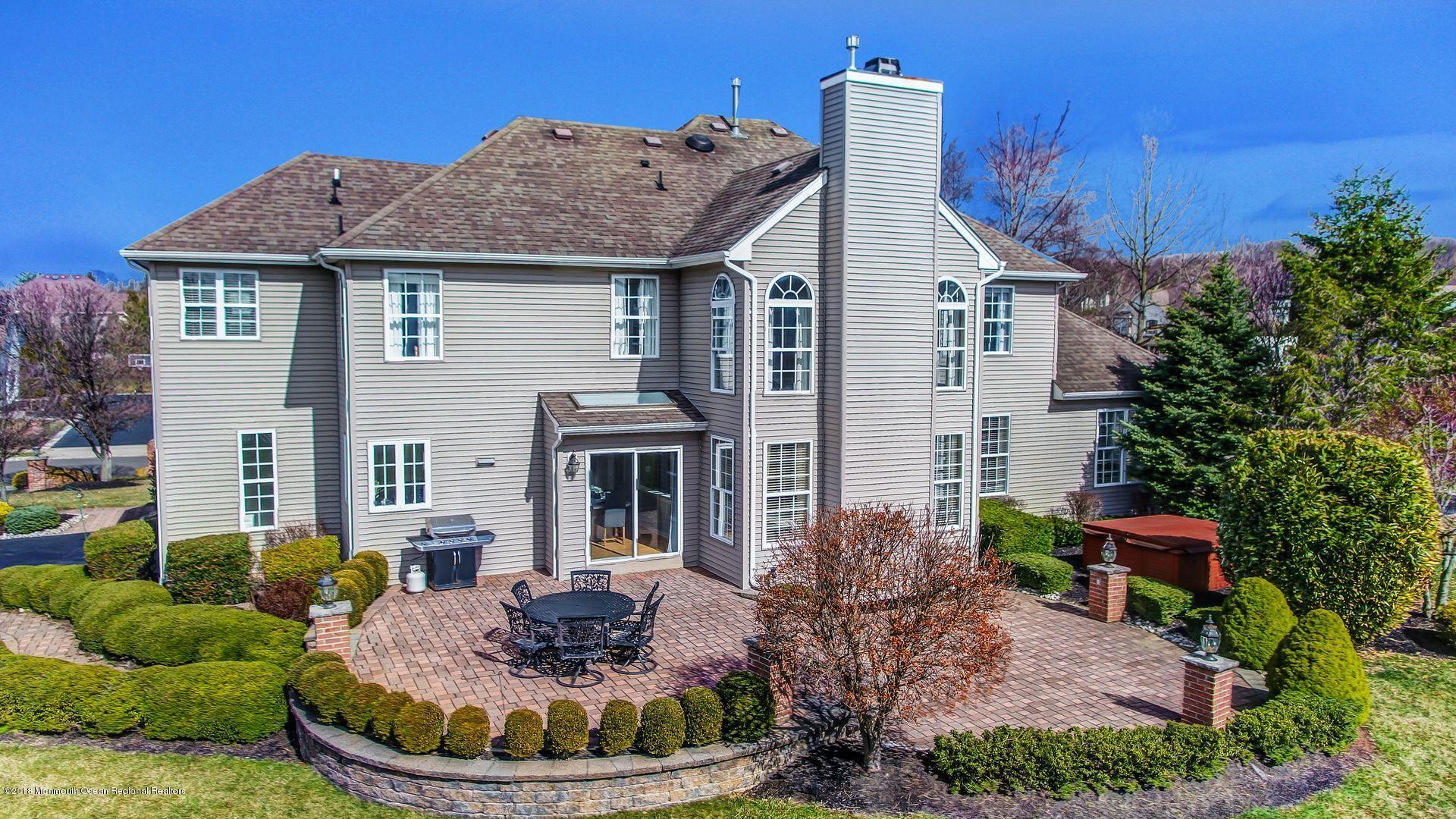 263 Pin Oak Road Freehold, NJ 07728 - Photo 56 of 60 a view of a house with a yard potted plants