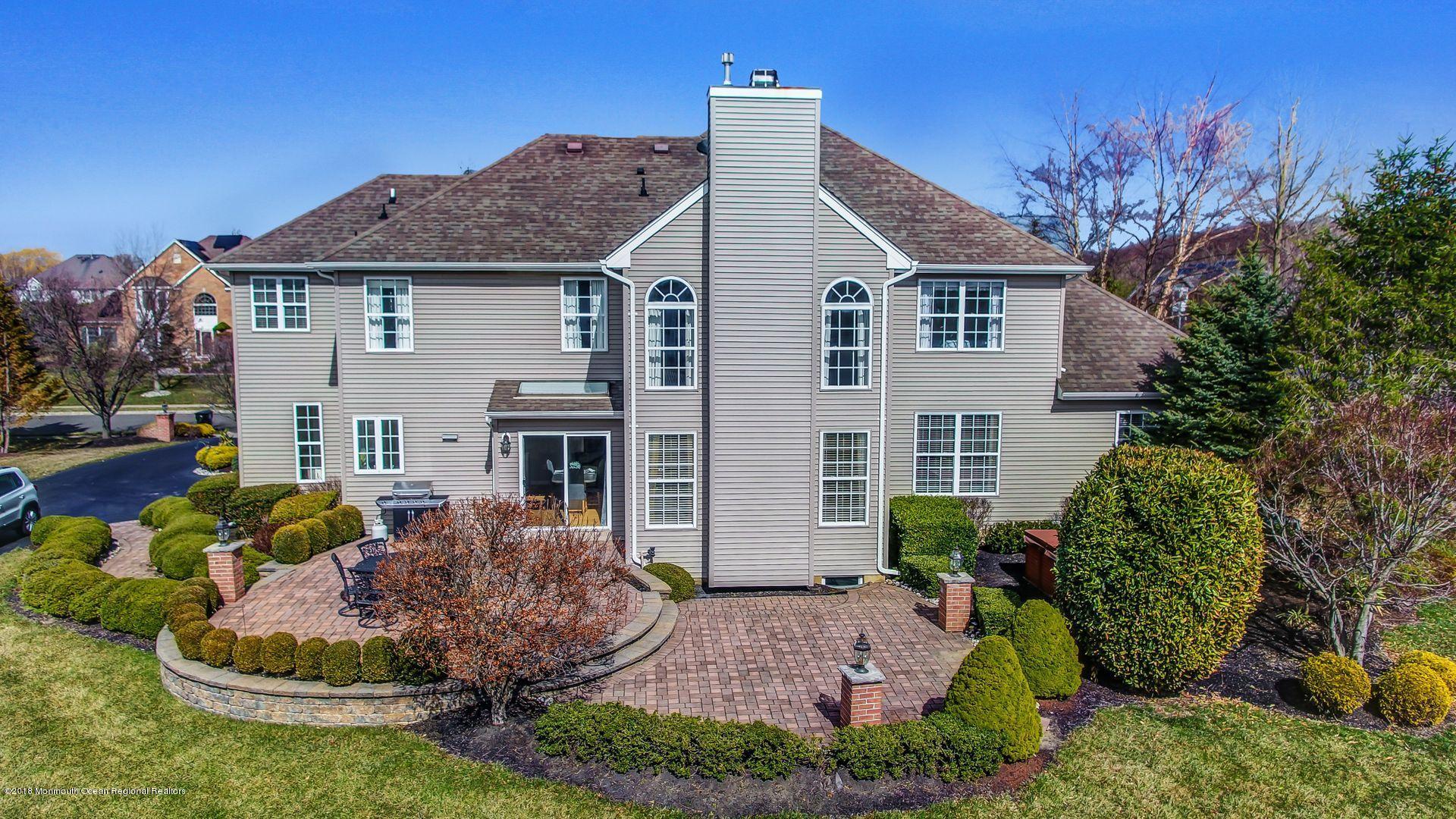 263 Pin Oak Road Freehold, NJ 07728 - Photo 57 of 60 a view of a house with a yard and plants