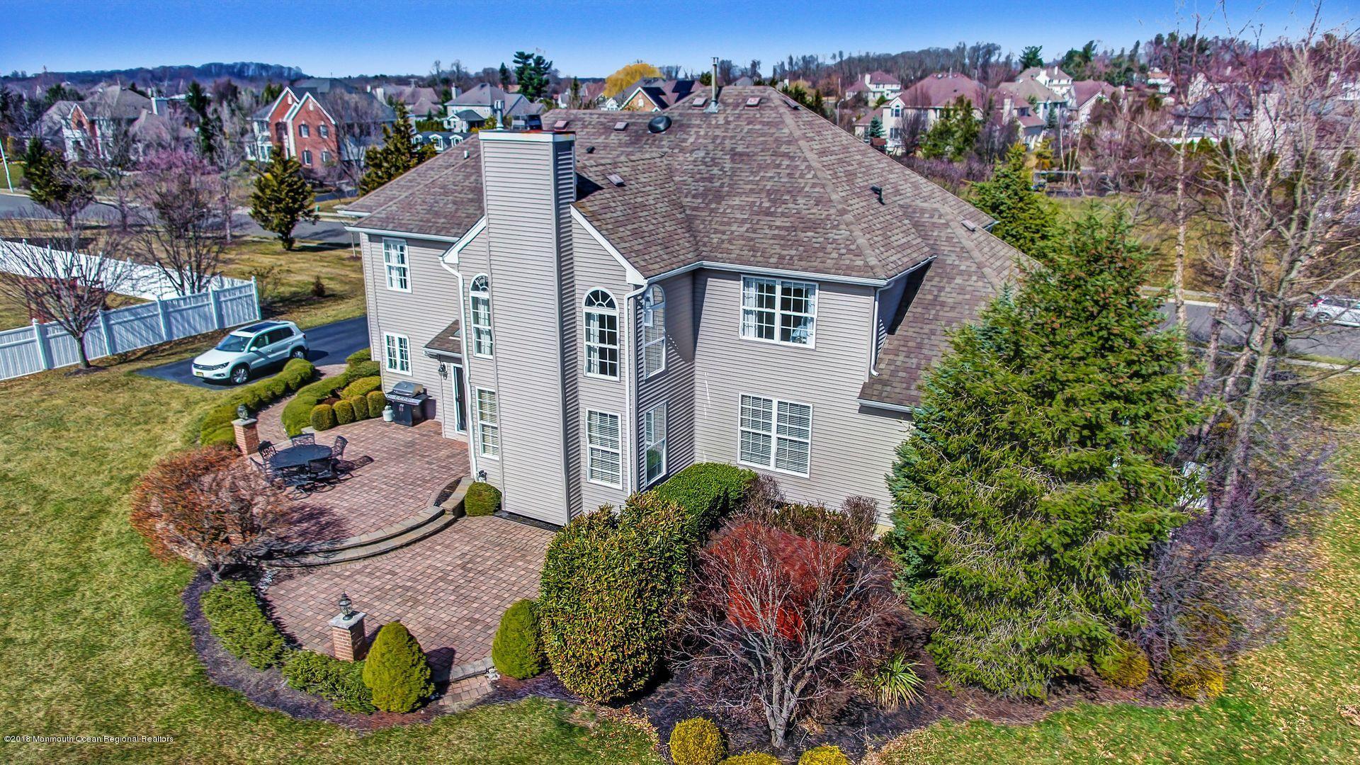 263 Pin Oak Road Freehold, NJ 07728 - Photo 58 of 60 an aerial view of a house with a yard and garden