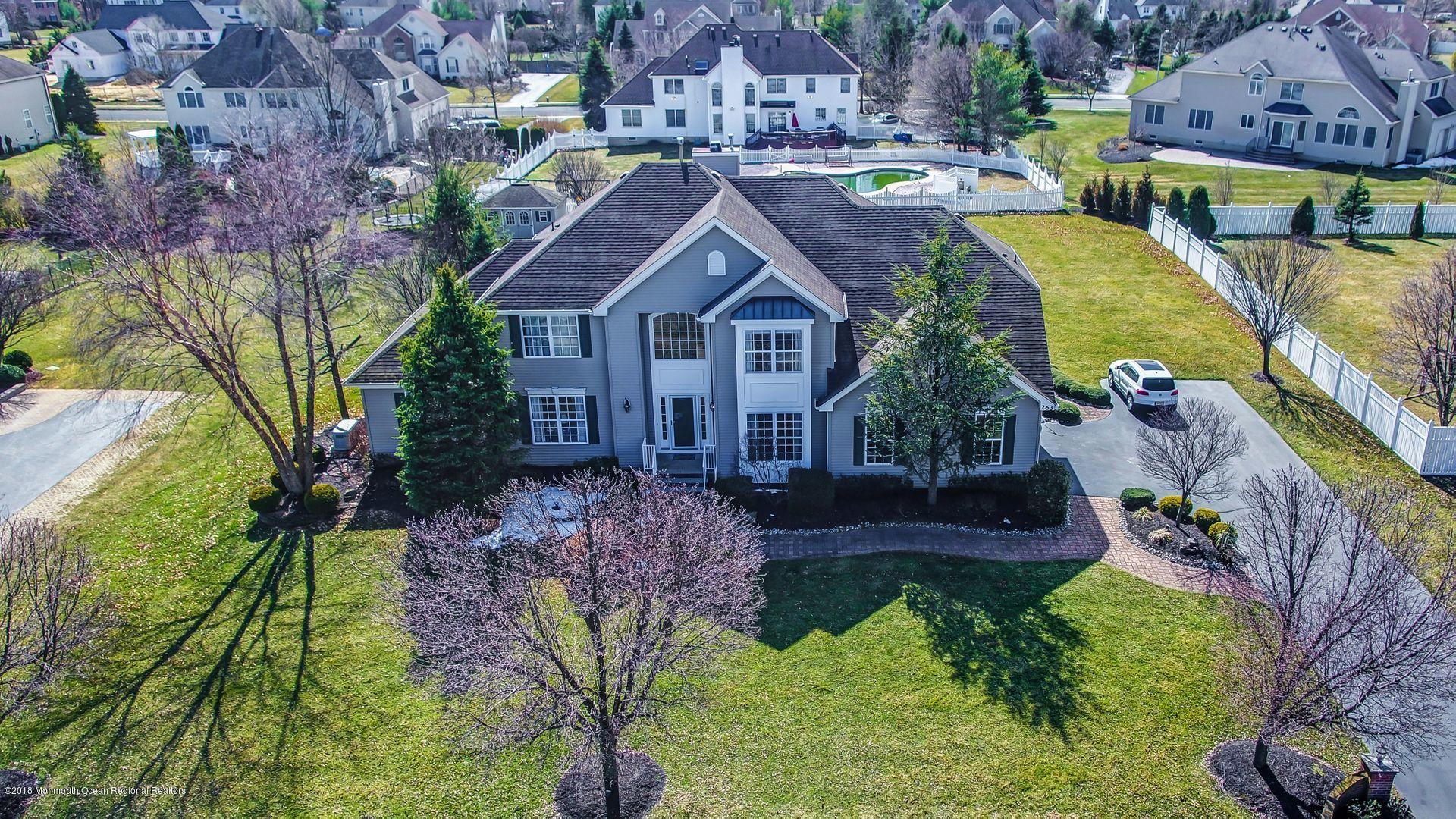 263 Pin Oak Road Freehold, NJ 07728 - Photo 6 of 60 a aerial view of a house with a yard and large tree