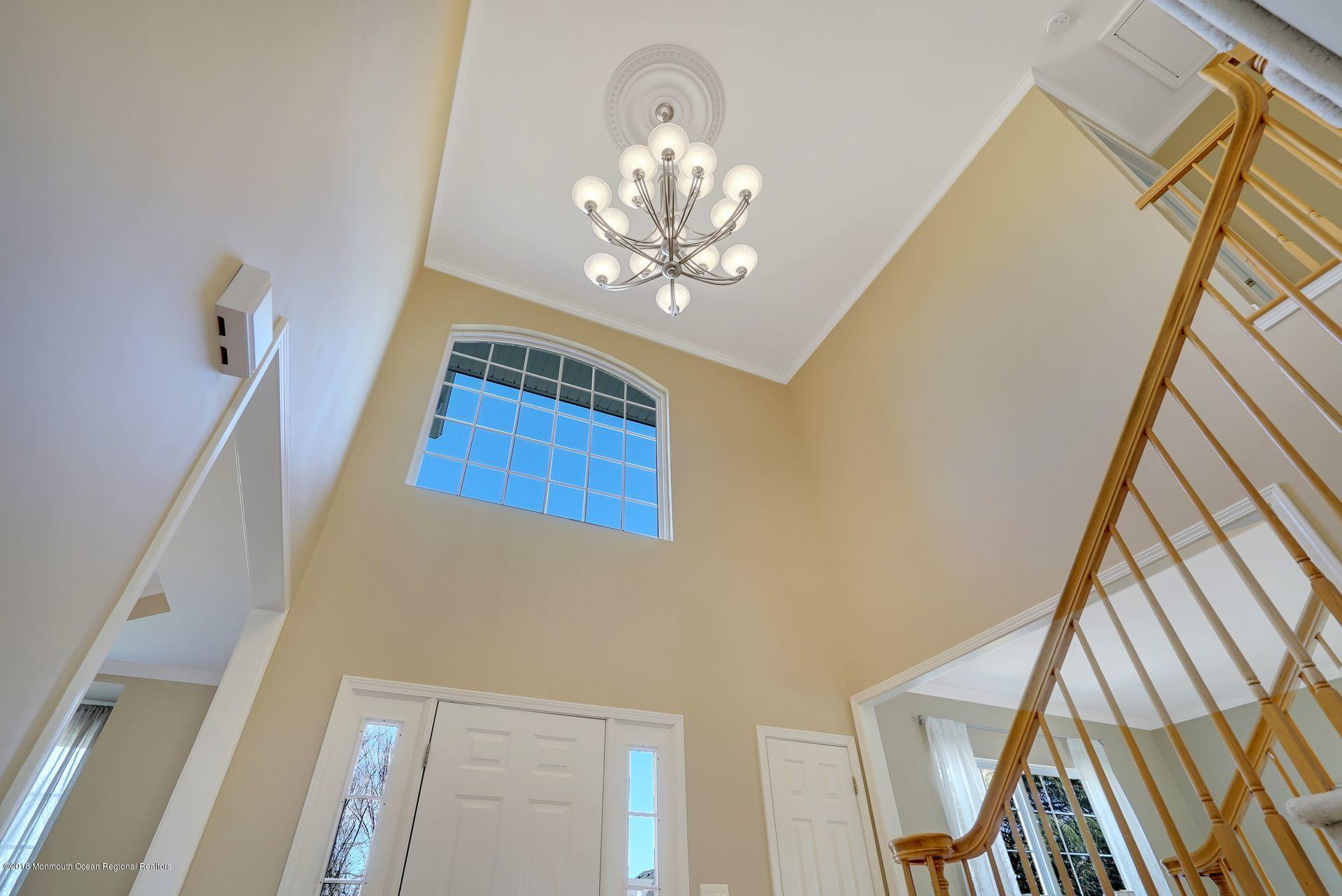 263 Pin Oak Road Freehold, NJ 07728 - Photo 10 of 60 a view of entryway with chandelier