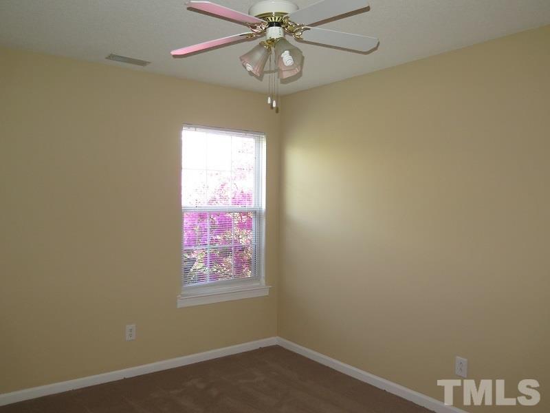 9136 Shallcross Way Raleigh, NC 27617 - Photo 9 of 13 en empty room with a window