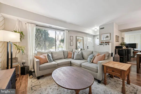 a living room with furniture and a large window