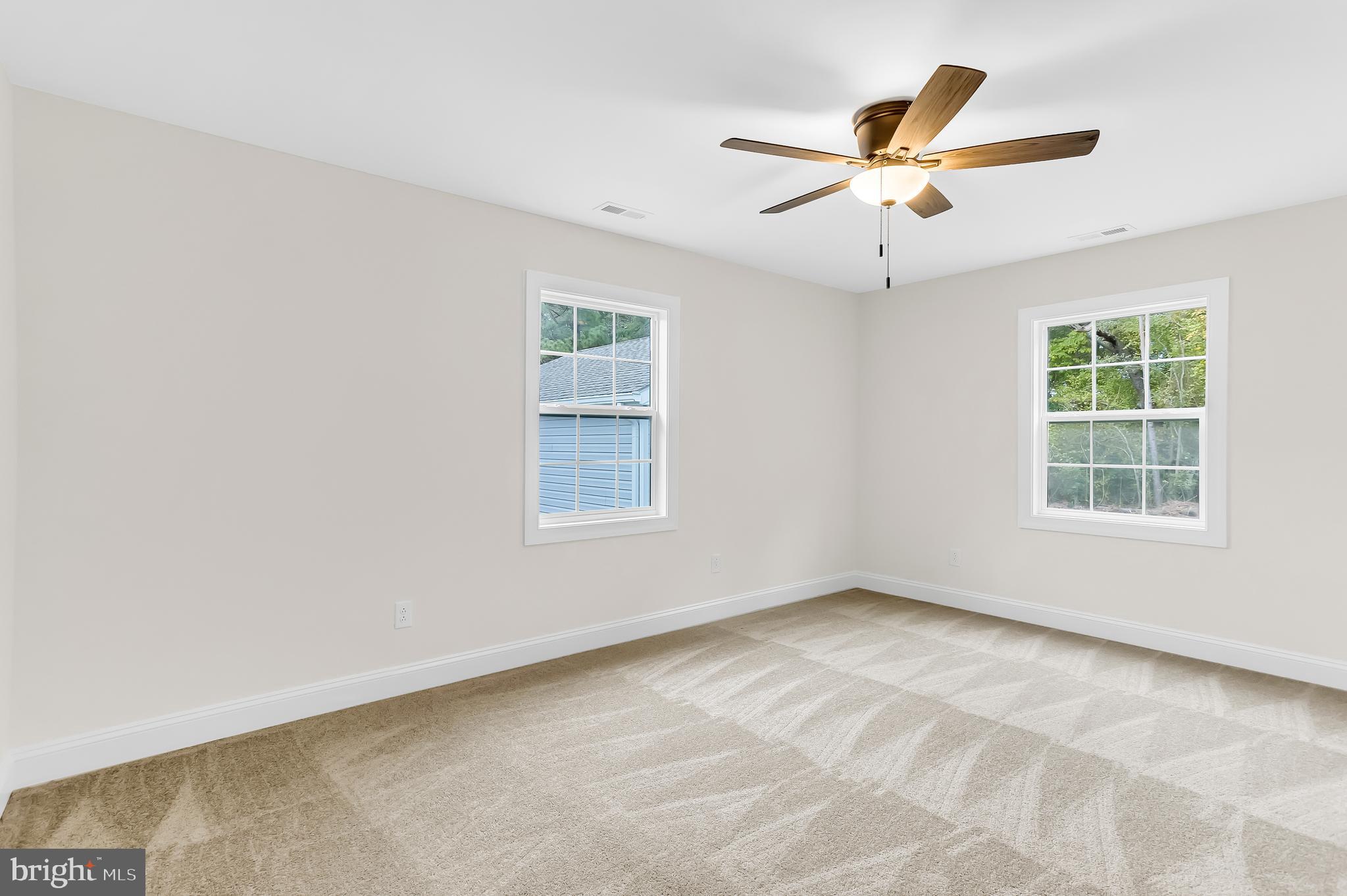 26519 Siloam Road Salisbury, MD 21801 - Photo 51 of 69 an empty room with windows and fan