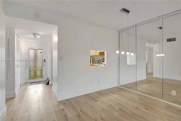 a view of a bathroom with wooden floor