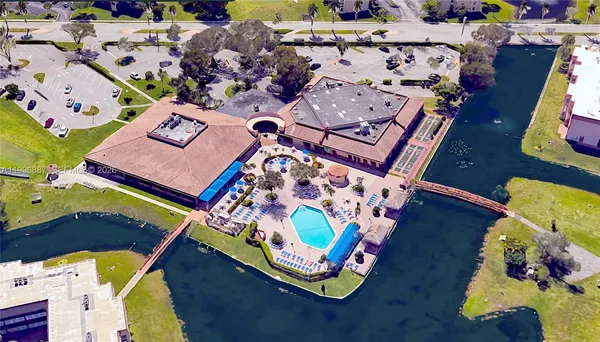 an aerial view of a gaming kitchen wooden floor and a dining space