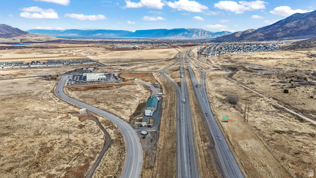 15371 Frontage Road Santaquin, UT 84655 - Photo 2 of 18 Bird's eye view of a mountainous background and a desert landscape