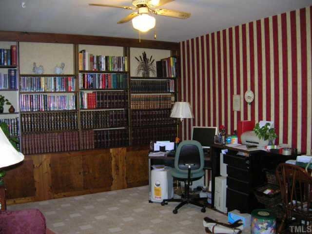 417 Harvard Street Raleigh, NC 27609 - Photo 2 of 9 Living room with built in bookcases and storage underneath. Other