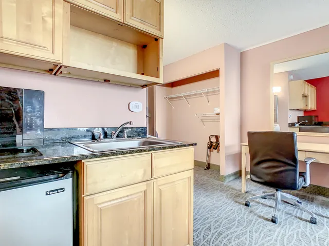 a kitchen with a sink and cabinets