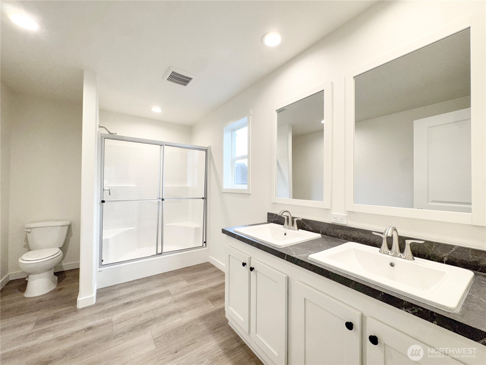 618 C Street Vader, WA 98593 - Photo 13 of 15 a bathroom with a double vanity sink toilet and a mirror