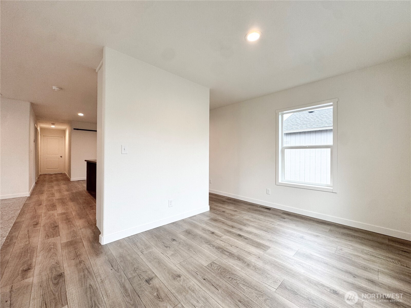 618 C Street Vader, WA 98593 - Photo 4 of 15 an empty room with wooden floor and windows