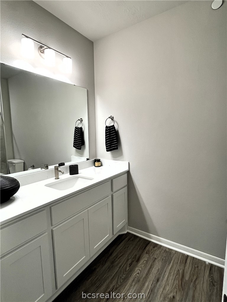 1326 Prairie Drive, Unit 1021 Bryan, TX 77803 - Photo 11 of 17 a bathroom with a double vanity sink and mirror