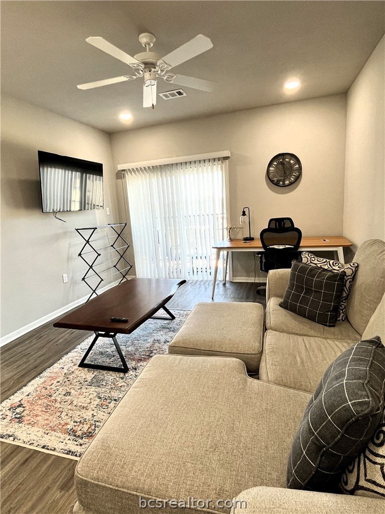 1326 Prairie Drive, Unit 1021 Bryan, TX 77803 - Photo 9 of 17 a living room with furniture and a window