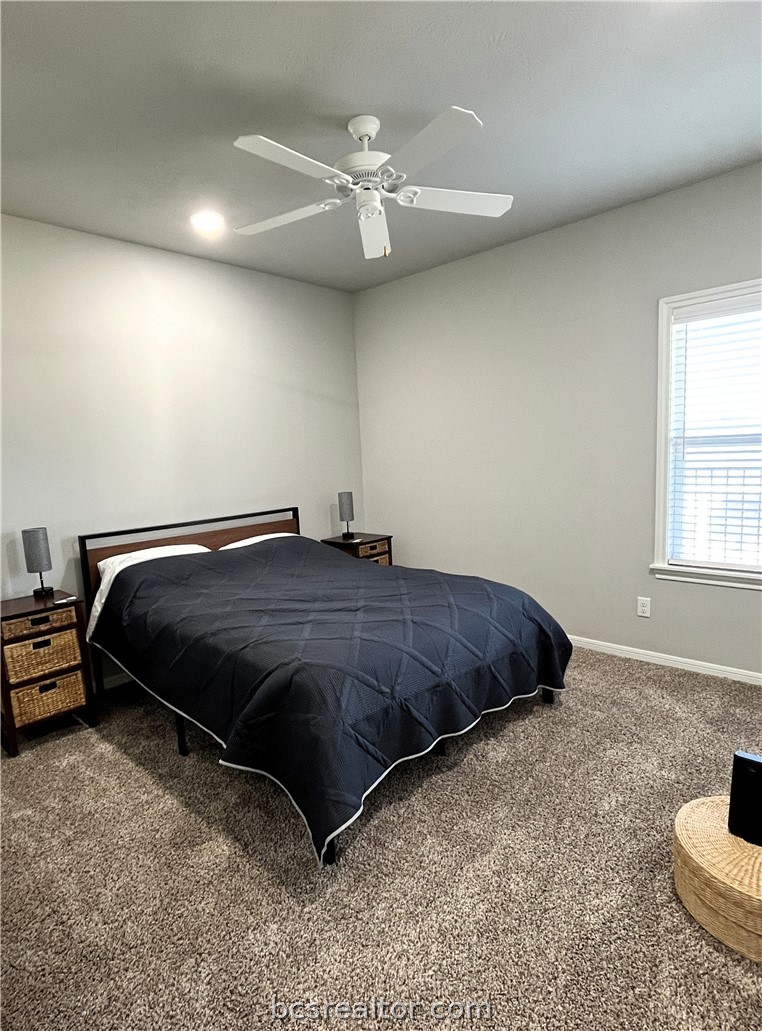 1326 Prairie Drive, Unit 1021 Bryan, TX 77803 - Photo 10 of 17 a bedroom with a bed and a dresser