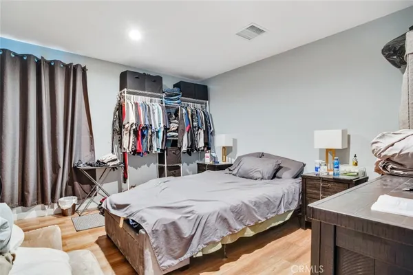 a view of staircase with wooden floor and white walls