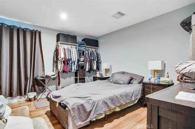 a view of staircase with wooden floor and white walls