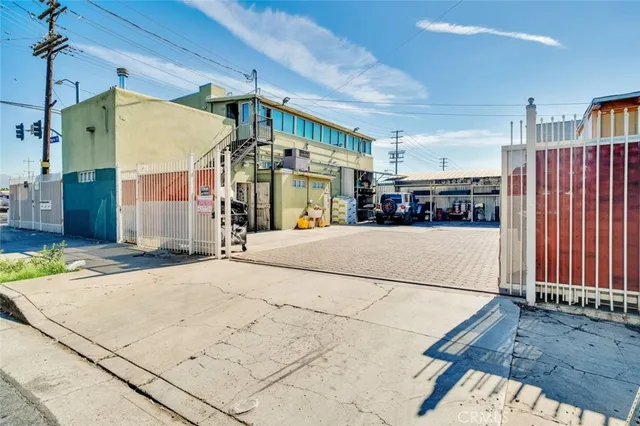 a utility room with stainless steel appliances furniture and a fireplace