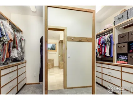 a living room with furniture and a book shelf