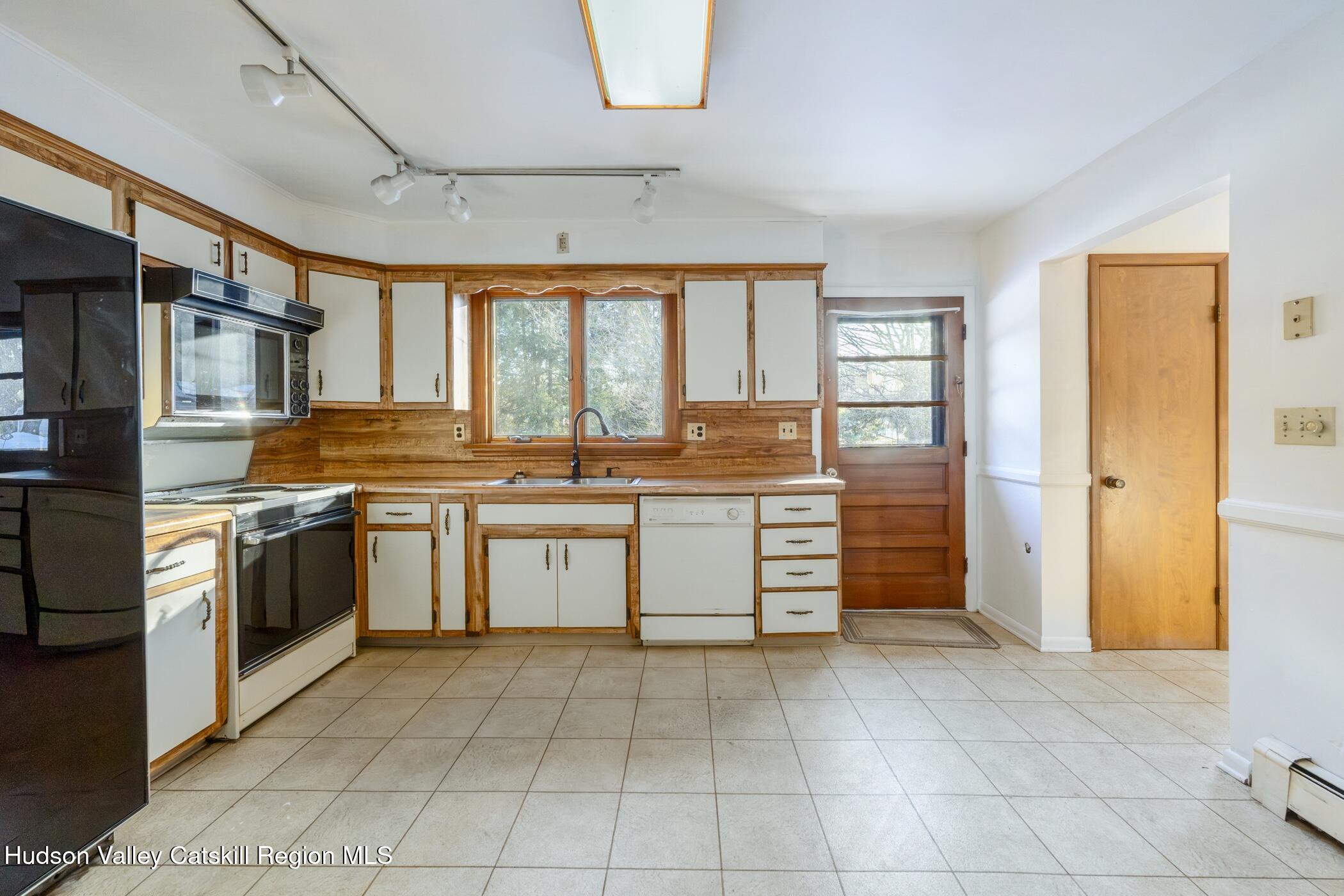 609 New Paltz Road Highland, NY 12528 - Photo 13 of 35 a kitchen with stainless steel appliances granite countertop a stove and a sink