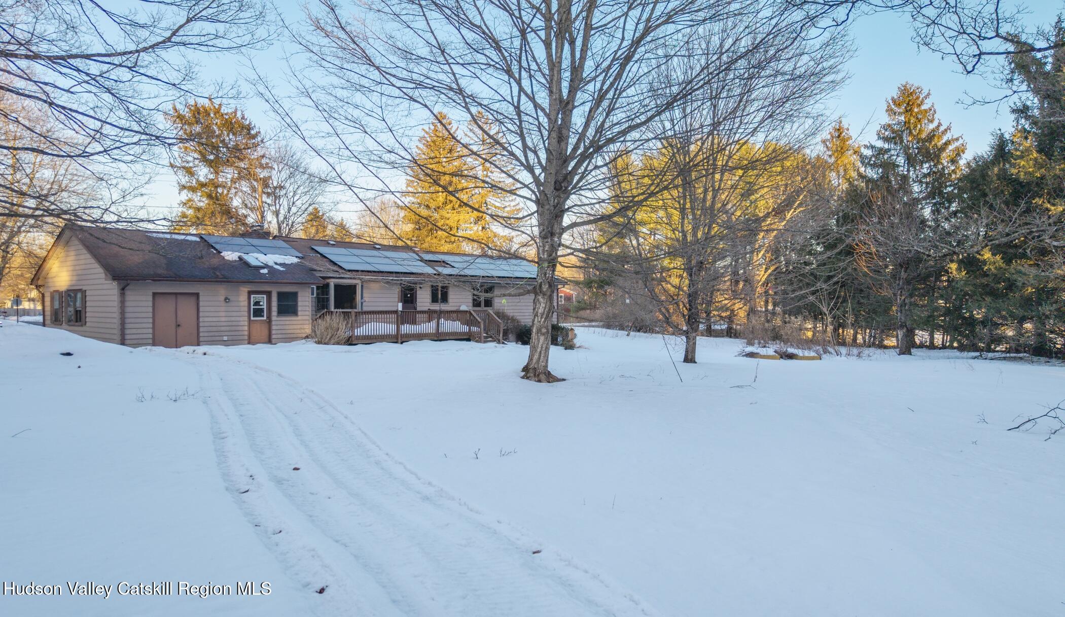609 New Paltz Road Highland, NY 12528 - Photo 29 of 35 a view of house with yard and trees in the background